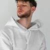 young-male-model-with-frizzy-hair-wearing-hoodie-mockup-in-minimalistic-background-scene3-075 off white hoodie
